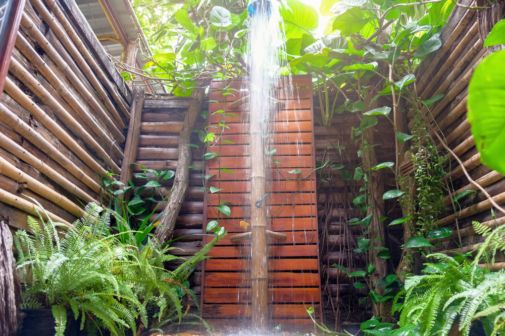 tropical rain shower open bathroom Outdoor shower with wood wall decoration with green plants
